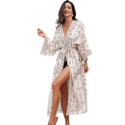 2025 Plus Size Swimsuit Coverup Dress Coastal Style Curvy woman in floral kaftan dress walking on tropical beach sunset